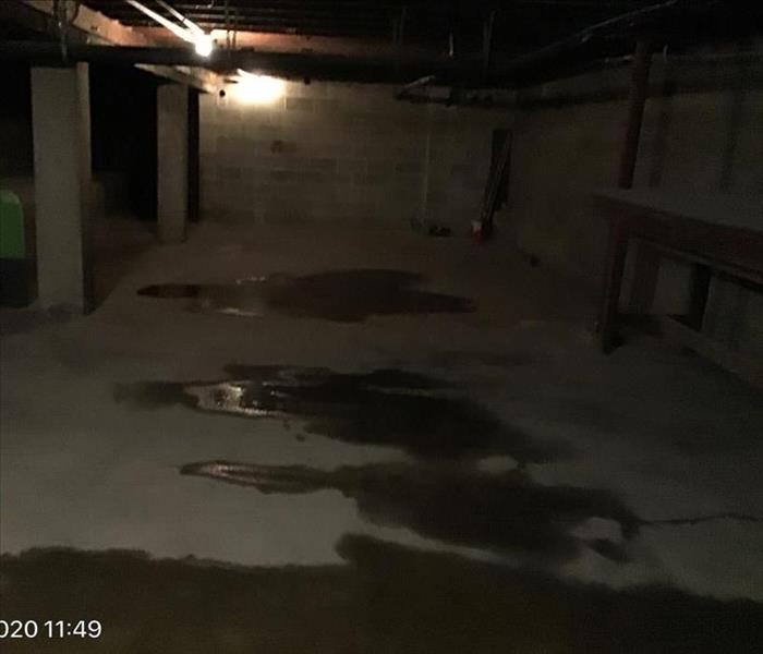 water after a storm in basement of a local business